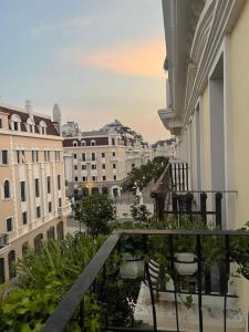 a balcony with a view of a city with buildings at HoangAnh Hotel in Ha Long