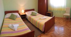 Postel nebo postele na pokoji v ubytování Villa Calypso