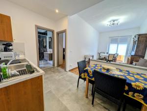 a kitchen and dining room with a table and chairs at Monviso in Fossano