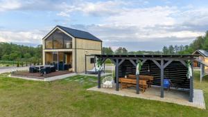 a modular home with a gazebo at Nini House Swietajno in Olecko