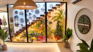 a store with a display case with plants in it at Pyramids Spiritual Hotel in Cairo