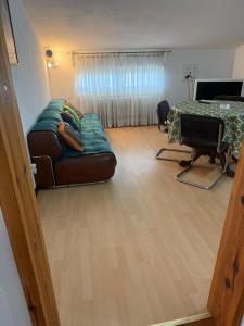 a living room with a couch and a bed at La mansarda in Miranda