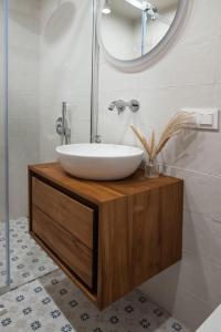 a bathroom with a white sink and a mirror at Sava Nida in Neringa