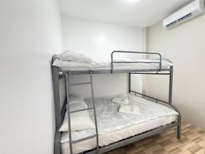 a bunk bed in a small room with a bunk bedscribed at Villa Dietze in Davao City