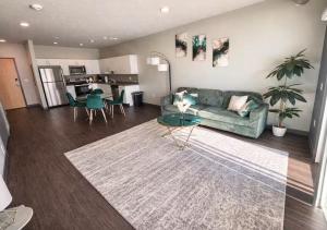 a living room with a couch and a table at Evergreen Nook in Des Moines