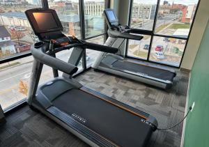 a gym with two treadmill machines and a window at Evergreen Nook in Des Moines +7 photos