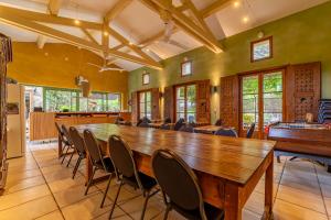 a large conference room with a large wooden table and chairs at Mas Escombelle in Barjac +72 photos
