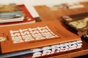 a stack of books sitting on a table at B&B De Mout in Diest