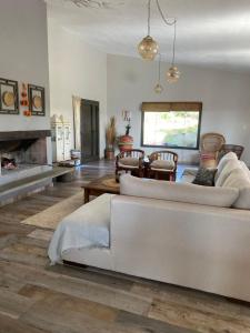 a living room with a couch and a fireplace at La Tina in Córdoba