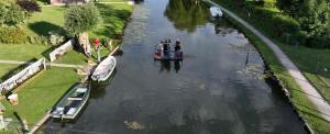 a group of people on a boat in a river at Maison La Béa-titude in Serques