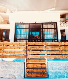 a stack of wooden pallets in front of a building at Corfu port apartment in Mantoúkion