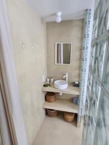 a bathroom with a sink and a mirror at Sublime chambre à endoume proche mer in Marseille