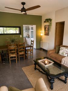 a living room with a couch and a table at Domaine Saveria in Ponte-Leccia