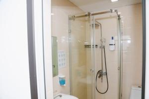 a bathroom with a shower with a glass door at Apple Hostel Bishkek in Bishkek +120 photos