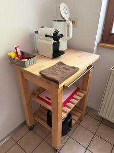 a table with a coffee maker on top of it at Forest Apartment-Forest Escape Menzenschwand in St. Blasien +20 photos
