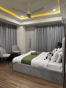 a bedroom with a large bed in a room at Seven Star Heights in Rawalpindi