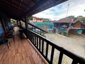 a balcony with a view of a water park at Pousada Figueira in Trindade