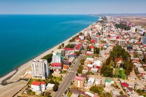 an aerial view of a city next to the water at Hotel Tamarastan in Kobuleti
