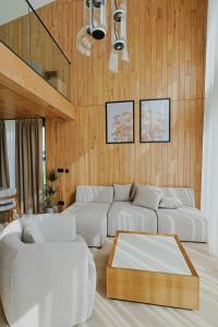 a living room with two white couches and a table at Espadrina Wellness & Spa in Ljubovija +29 photos