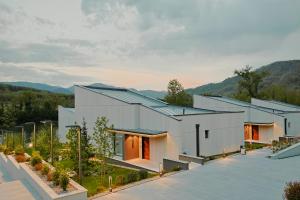 an aerial view of a house with mountains in the background at Espadrina Wellness & Spa in Ljubovija