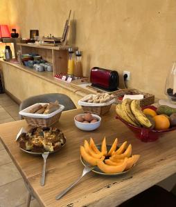 a wooden table with bowls of food on it at Yak Avenir in Aiguilles