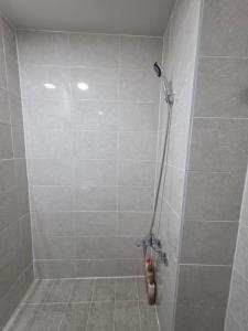 a bathroom with a shower with a toilet in it at Dear, U in Gyeongju