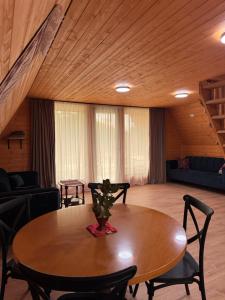 a dining room with a table and chairs at NerNeri Cottage Martvili in Martvili +20 photos
