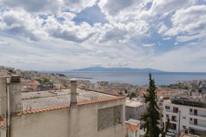 a view of the city and water from a building at Nayra View & Spa in Kavála