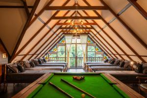a room with a pool table in a room at K Manor in Vāzhākulam