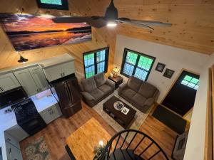 an overhead view of a kitchen and living room in a log cabin at The Old Orchard Cottage in LaFayette