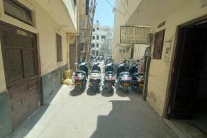 a row of motorcycles parked next to a building at Bagol Niwas in Udaipur