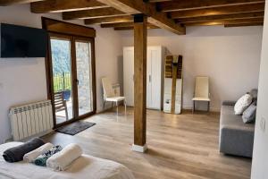 a living room with a couch and a table at La Era de Lardiés in Lardiés