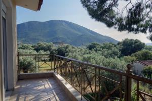 a balcony with a view of a mountain at Beach Residence Walk to Beach Garden - Parking in Chalkida