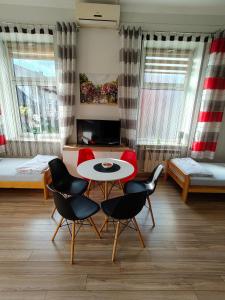 a room with two beds and a table and chairs at Torino in Zator +79 photos