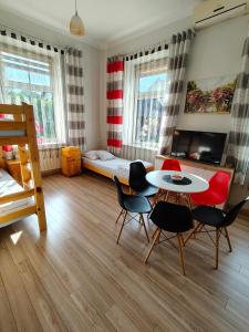 a bedroom with a table and chairs and a bed at Torino in Zator
