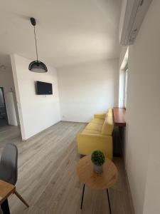 a living room with a couch and a table at Wenecja Apartment in Wadowice