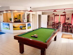 a pool table in the middle of a room at Eurocéan Adonis Budget in Guérande