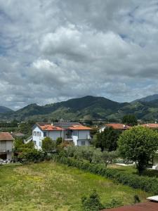 a group of houses with mountains in the background at Casa Tania in Massa