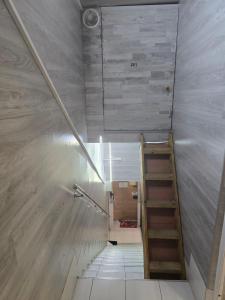 a staircase in a room with a stair case at Chip Central Host in Chişinău