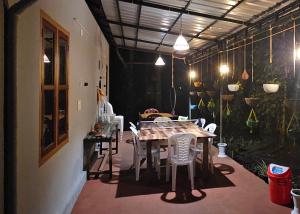 a dining room with a table and chairs in it at Johny's Villa, Homestay, Wayanad in Pulpally
