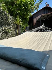 a hammock in front of a building at Mambo House in Milan