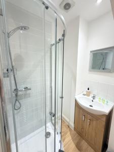 a bathroom with a shower and a sink at Parliament in Gloucester +31 photos