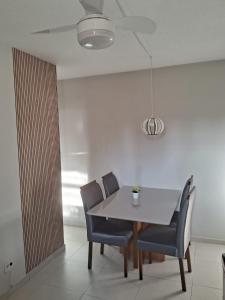 a dining room with a table and chairs at Praia da Costa próx da Praia in Vila Velha +6 photos