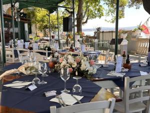 a table set up for a wedding with a blue table cloth at Villa Tergeste in Trieste