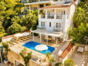 an aerial view of a villa with a swimming pool at VILLA LEDA MARE KALKAN Sea View, Private Pool & Beach Clubs in Kalkan
