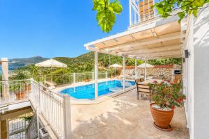 a villa with a swimming pool and a view at VILLA LEDA MARE KALKAN Sea View, Private Pool & Beach Clubs in Kalkan +46 photos