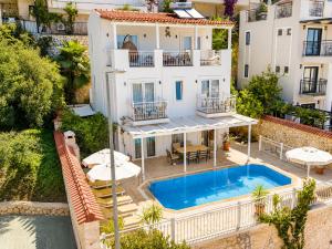 an aerial view of a house with a swimming pool at VILLA LEDA MARE KALKAN Sea View, Private Pool & Beach Clubs in Kalkan