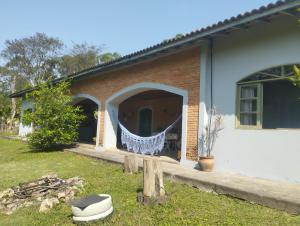 a house with a blanket hanging from the front of it at Pousada rotas e ritmos in São Paulo