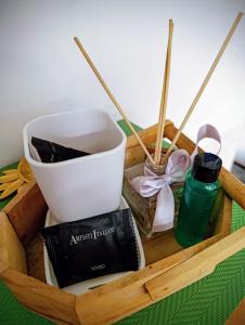 a wooden tray with a box filled with different items at Apartman Centar 2 in Kruševac