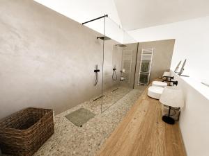 a bathroom with a toilet and a glass shower at Maison Unifamiliale in Theux +18 photos